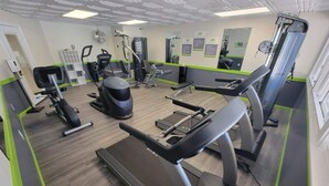 A gym with treadmills, elliptical machines, and weight equipment. - Family-Friendly Cottage Near Disney with Pool, Playground & Resort Amenities (Kissimmee)