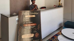 A pottery workshop sign with details on activities and included items. - CHERRY TREE (Greater Noida)