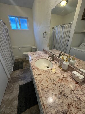 Hair dryer, towels, soap, toilet paper