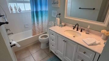 Shower, hair dryer, towels, shampoo