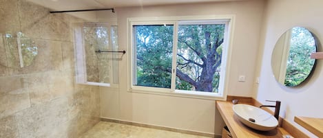 Shower, hair dryer, towels, toilet paper
