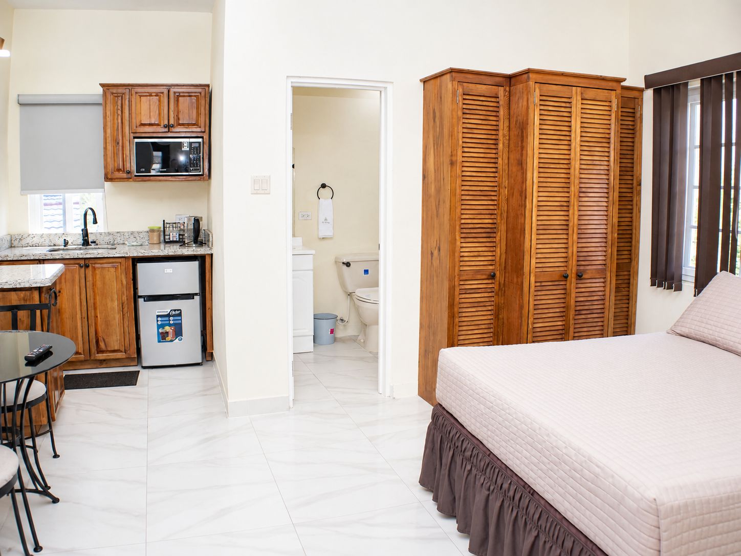Open studio layout with kitchenette and storage