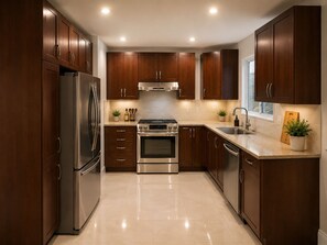 A modern kitchen with dark wooden cabinets, stainless steel appliances, and a tiled floor.
