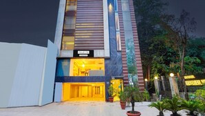 A modern building with a sign for 'PALETTE' and a 'HOTEL IMPERIAL' sign in the background. - Suite Palette South Delhi Imperial Villa (New Delhi)