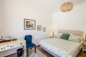 A bedroom with a bed, a desk, a chair, and a hanging light fixture. - Villa Chautard - Four Bedroom Villa, Sleeps 8 (Tourrettes)