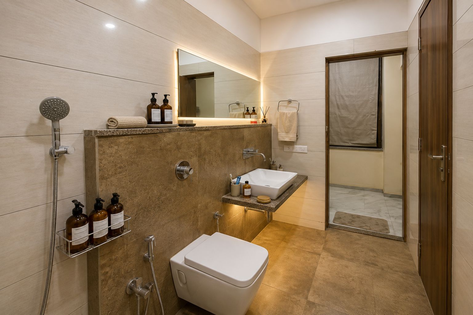 A modern bathroom with a shower, two sinks, a toilet, and a large mirror.