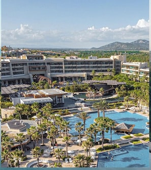 A resort with multiple swimming pools, palm trees, and a large building complex. - Thanksgiving in beautiful San José del Cabo at Grand Mayan one bedroom (San José del Cabo)