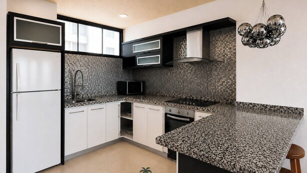 A modern kitchen with a black and white backsplash, a built-in microwave, and a stainless steel range hood. - Modern 2 Bedroom apartment in Juangriego with Pool (Juangriego)