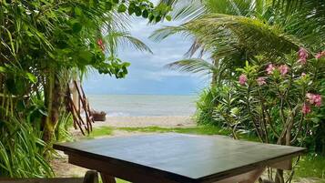 A table with a view of a beach and ocean.