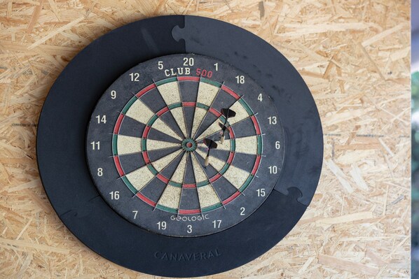 A dartboard with the brand 'CANAVERAL' and 'CLUB 500' visible.