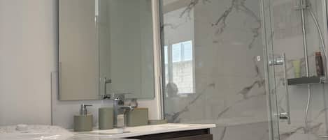 Shower, towels, soap, toilet paper