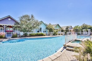 A swimming pool surrounded by houses with a clear sky. - Gulf-View Home with Deeded Beach & Pool, Seacrest (Seacrest)