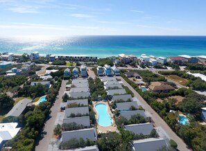 An aerial view of a coastal resort with multiple buildings, swimming pools, and a beach in the background. - Gulf-View Home with Deeded Beach & Pool, Seacrest (Seacrest)