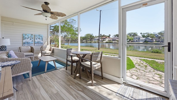 A covered patio with a ceiling fan, a pool table, and outdoor seating. - Morning Glory - Historic Downtown (St. Augustine)