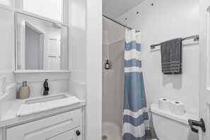 Shower, hair dryer, towels