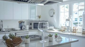 Full-sized fridge, stovetop, cookware/dishes/utensils