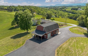 A rural property with a large barn, open fields, and a winding road. - The Gingerbread Nest, a private nature retreat (Glasgow)