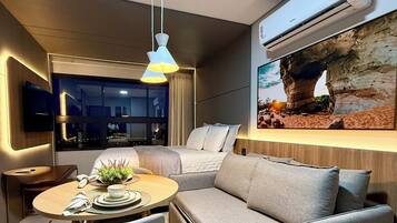 Apartamento luxo, vista para o lago | Área de estar