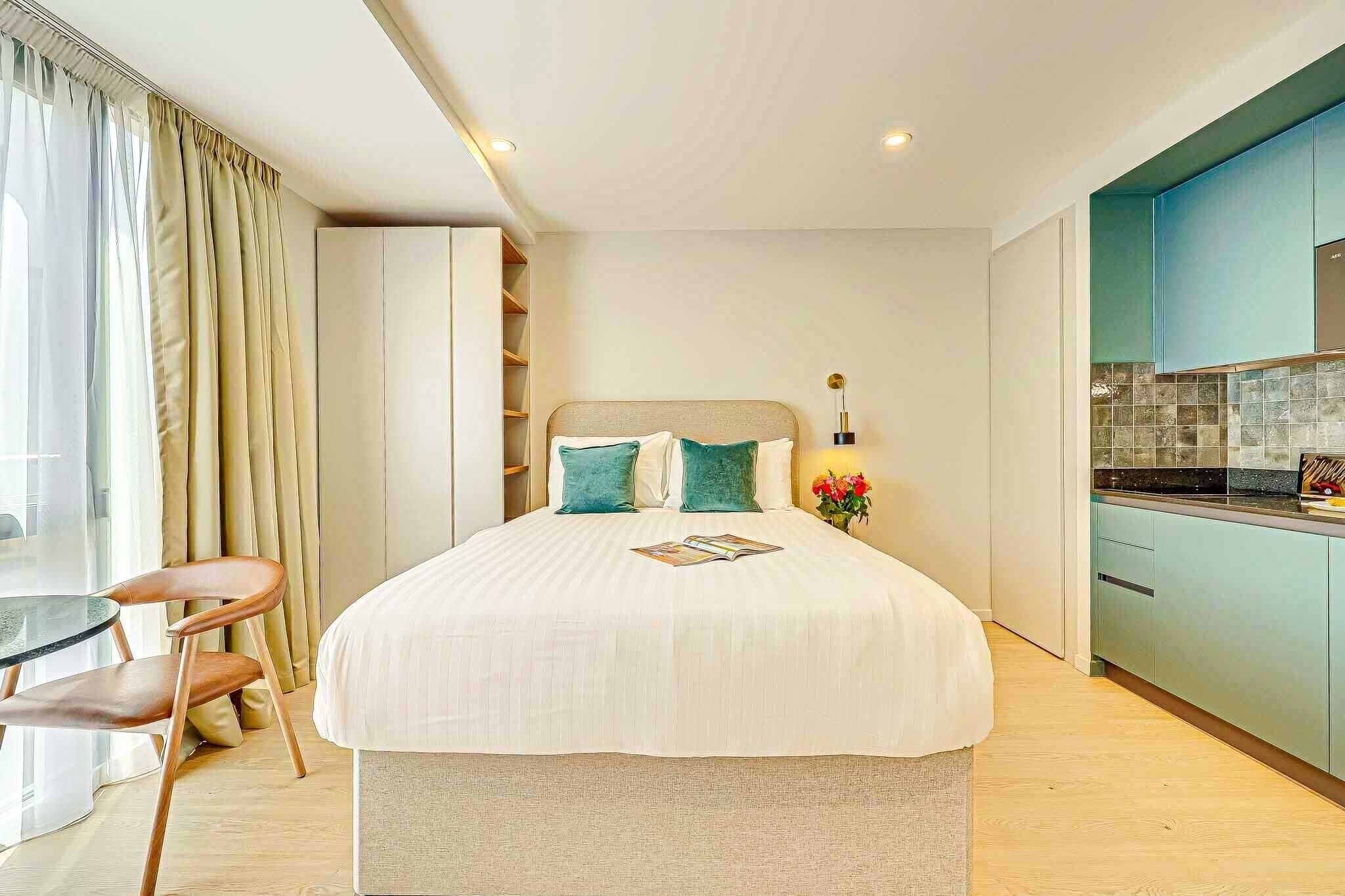 1 bedroom, desk, iron/ironing board, travel crib