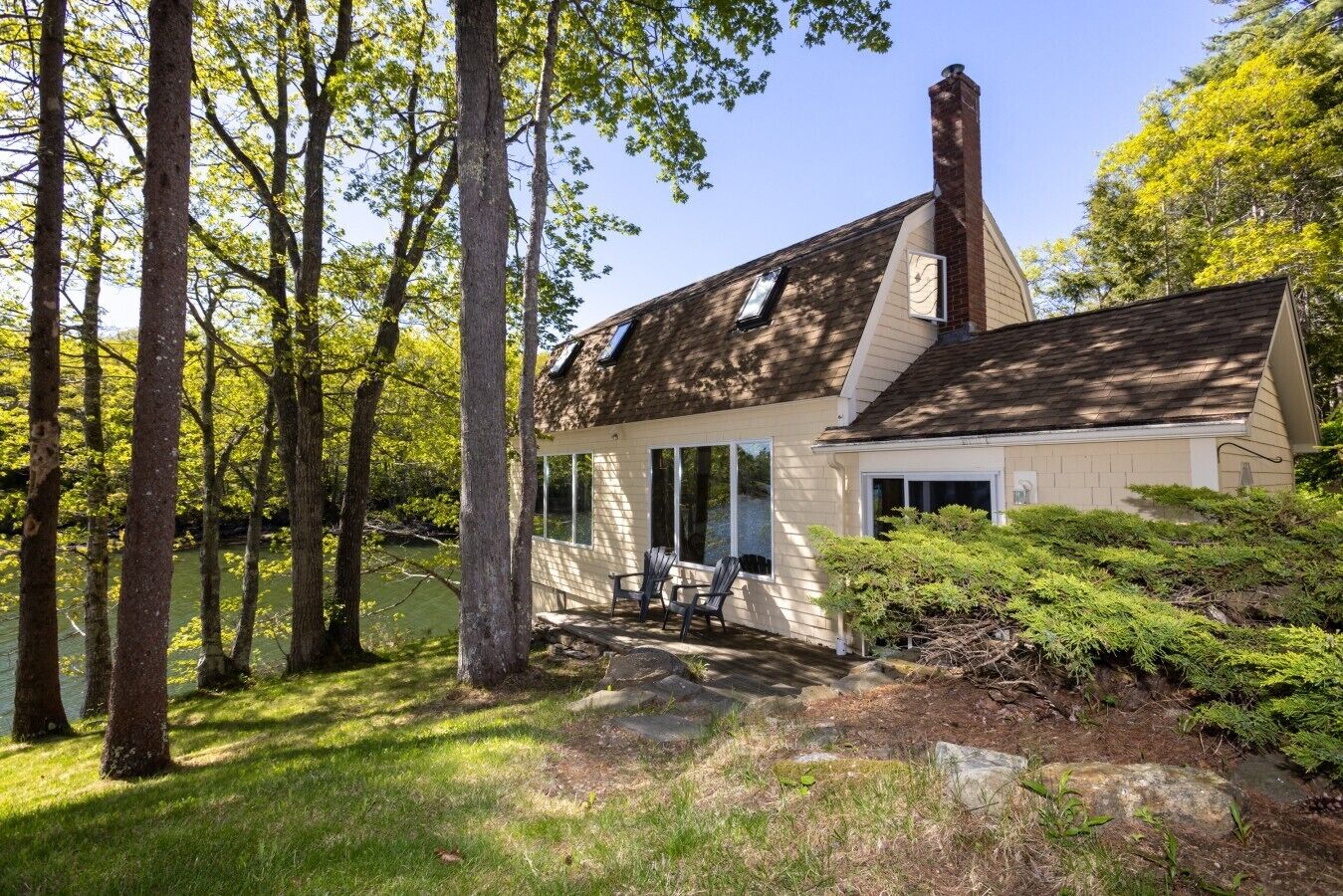 The boathouse has parking space for two cars, and is a short walk down from the road set directly on the Sheepscot River