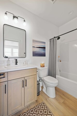 Shower, hair dryer, towels, shampoo