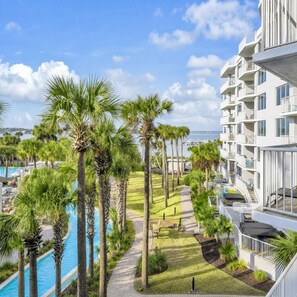 A resort with a pool, palm trees, and a view of the sea. - New Listing! Summer Openings! Destin West Resort (Fort Walton Beach)