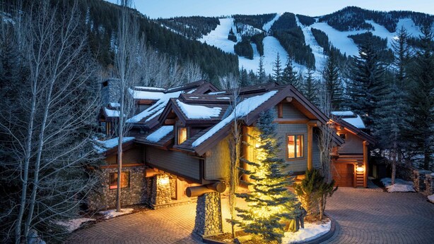 A lodge with a stone facade, wooden exterior, and a snow-covered roof. - Private Sun Valley Lodge | Walk to Lift + Hot Tub (Ketchum)