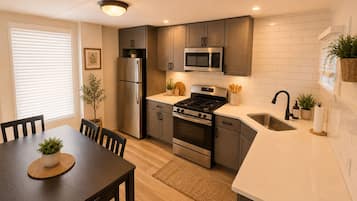 Coffee/tea maker, fridge, microwave, oven