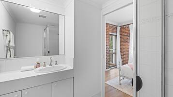 Shower, hair dryer, towels, soap