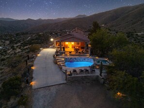 A house with a swimming pool, a covered patio, and a starry night sky. - Casa Sole | Pool | Spa | Near Palm Springs (Morongo Valley)