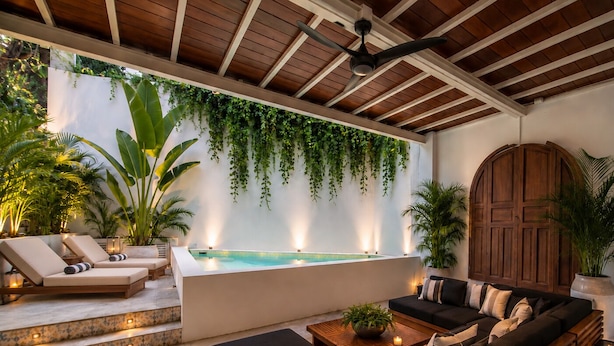 A modern outdoor lounge area with a pool, lounge chairs, a sofa, and potted plants. - Ava 19 Adults Only Villa - Bed & Breakfast (Puerto Vallarta)