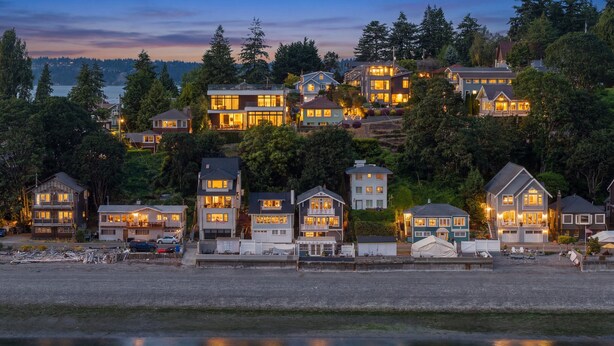 A waterfront residential area with houses, a dock, and a calm body of water. - Perch - Waterfront Cabana | Puget Sound & Rainier Views (Seattle)