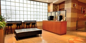A reception area with a counter, seating, and a large window. - Rakuten STAY URBAN ogikubo (Tokyo)