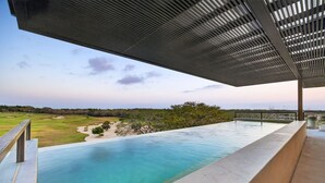 A swimming pool with a view of a golf course and distant landscape. - New Family Luxury Golf Penthouse With Private Pool (Punta de Mita)