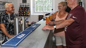 A bar area with a counter, beer taps, and a window. - Comfortable mobile home - 2 guests (Les Achards)