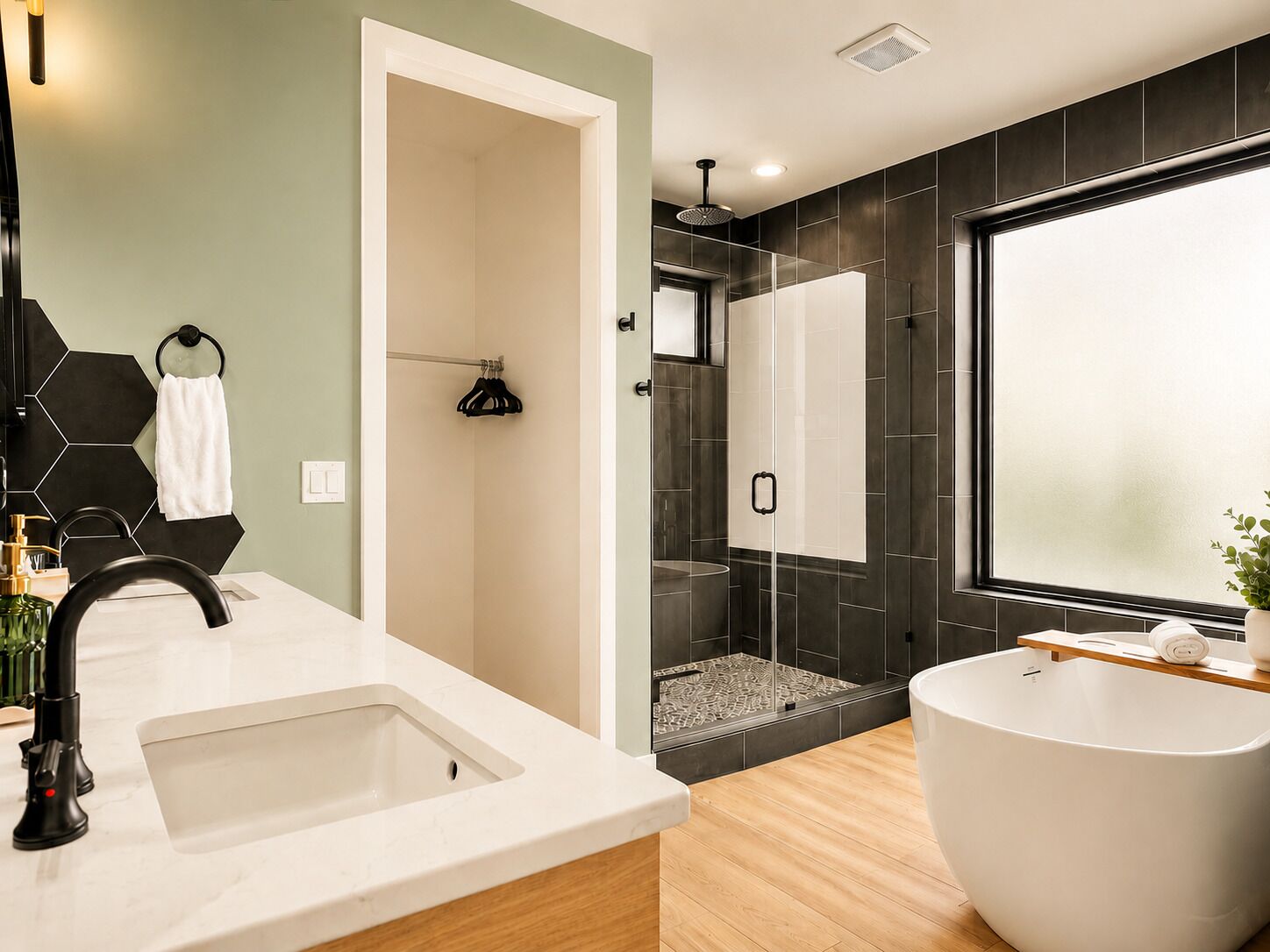 A modern bathroom with a freestanding bathtub, a shower area, and a large mirror.