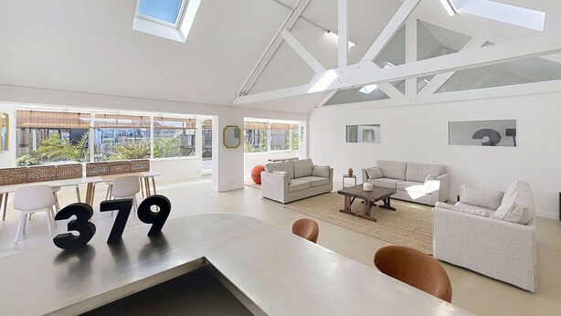 A spacious living area with a high ceiling, large windows, and a modern design. - Beach house with AC - 6 guests (Saint-Pair-sur-Mer)