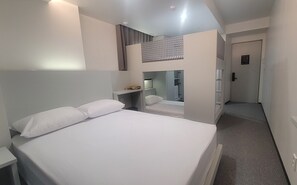 A hotel room with a bed, a desk, a wardrobe, and a mirror. - Stay Together in Seoul (Seoul)