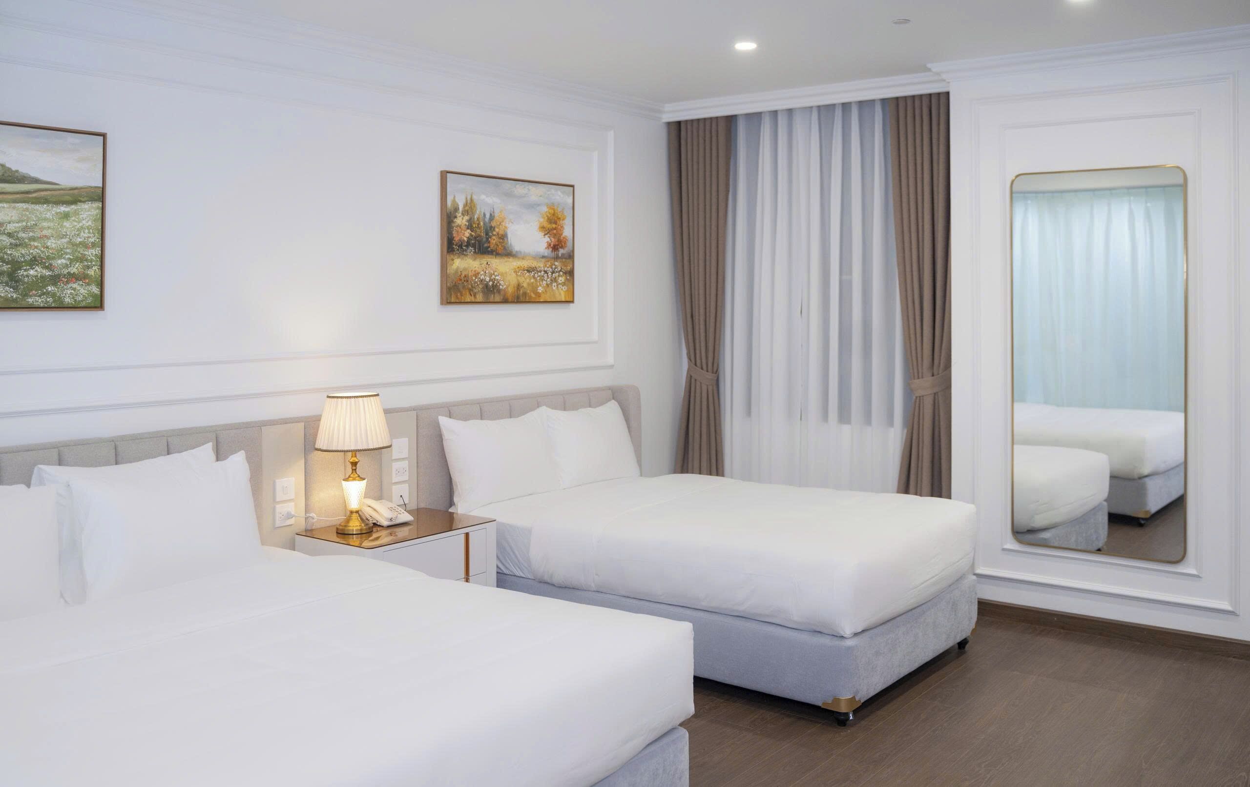 Deluxe Triple Room, Hill View | In-room safe, laptop workspace, blackout drapes, iron/ironing board