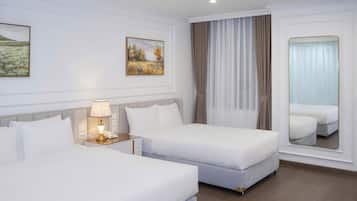 Deluxe Triple Room, Hill View | In-room safe, laptop workspace, blackout drapes, iron/ironing board