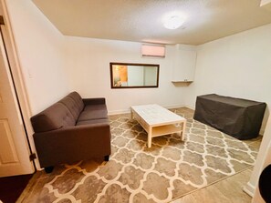 Living area - Welcome! This is a private 1-bedroom lower-level basement suite in our home. (Ajax)