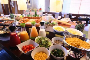 A buffet table with various food items and condiments. - Juraku Stay Niigata (Niigata)
