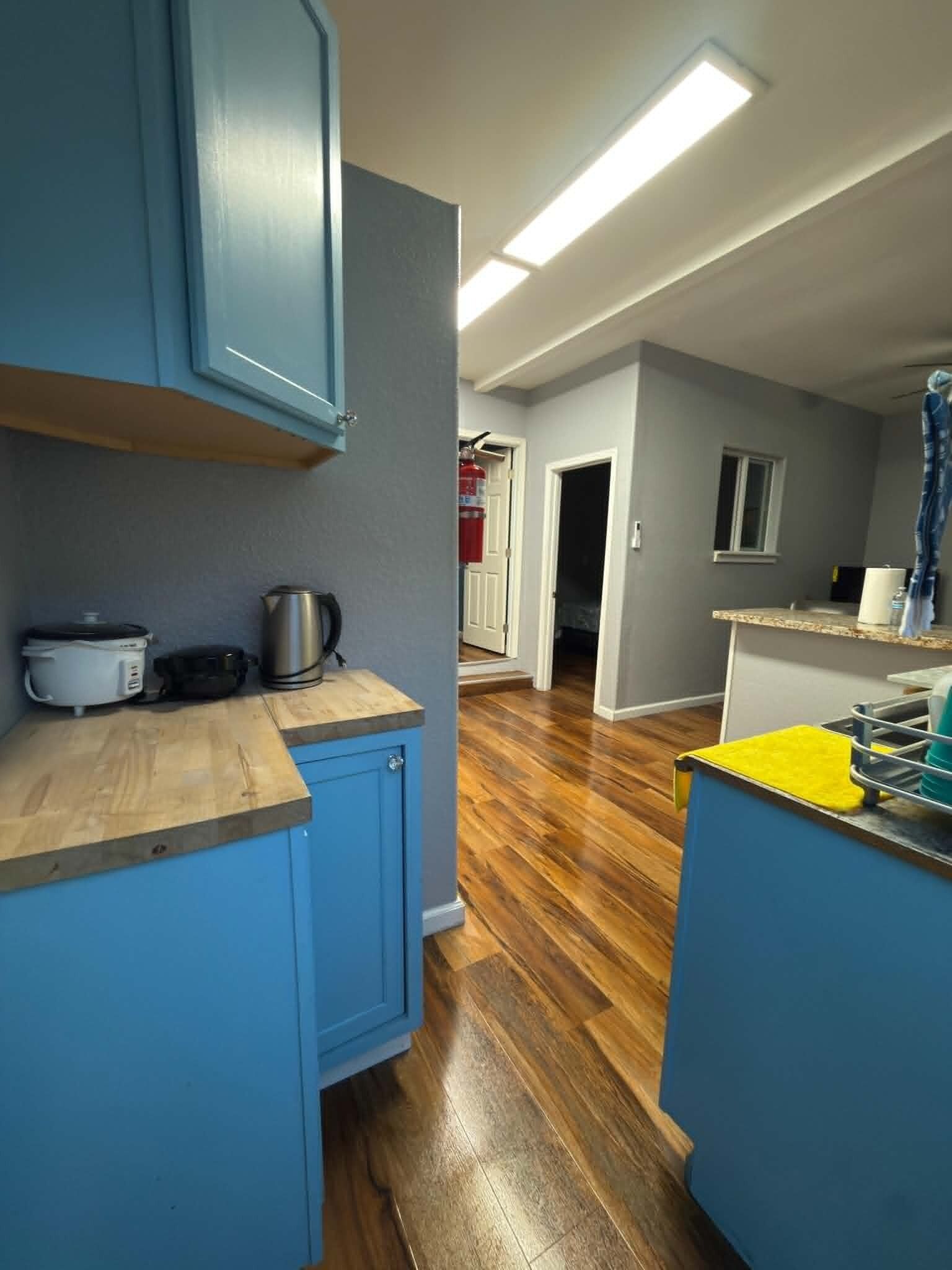 Fridge, microwave, stovetop, coffee/tea maker