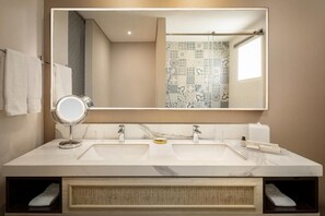 A bathroom with a large mirror, two sinks, and a towel rack. - Ermita Cartagena, A Tribute Portfolio Hotel (Cartagena)