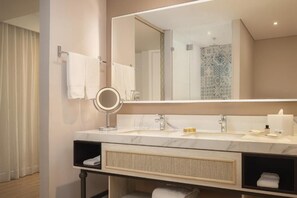 A modern bathroom with a large mirror, a sink, and a vanity with shelves. - Ermita Cartagena, A Tribute Portfolio Hotel (Cartagena)
