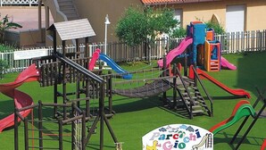 A playground with slides and climbing structures.