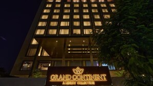 A multi-story hotel building with illuminated windows and a sign that reads 'Grand Continental A Luxury Collection.' - Grand Continent Luxury Collection, Udaipur (Udaipur)