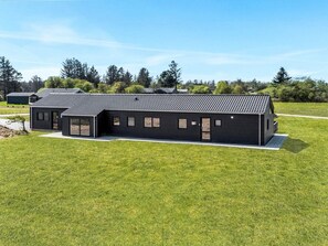 A modern, single-story building with a flat roof, large windows, and a covered entrance. - 5 Star Holiday Home in Hjorring (Hjørring)