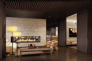 A modern interior with a fireplace, seating, and a wooden ceiling. - Roomers Parkview, A Luxury Collection Hotel, Frankfurt (Frankfurt)