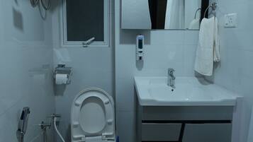 Shower, free toiletries, slippers, towels